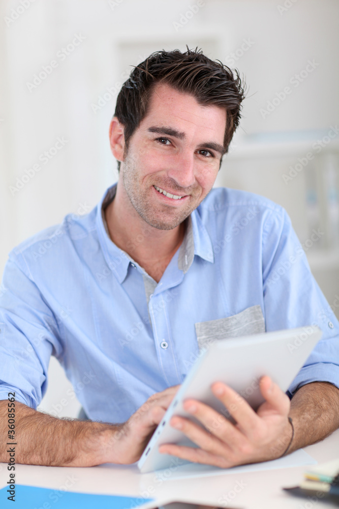Office worker using electronic tablet Office worker using electronic tablet