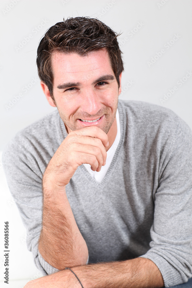 Portrait of handsome guy with hand on chin Portrait of handsome guy with hand on chin