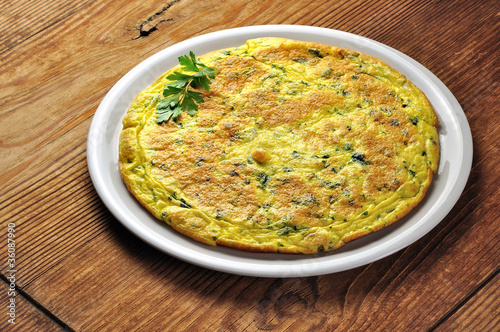 Italian omelette with parsley and parmesan cheese photo