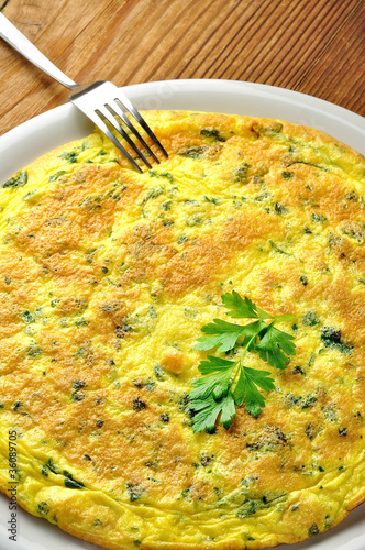 Italian omelette with parsley and parmesan cheese photo