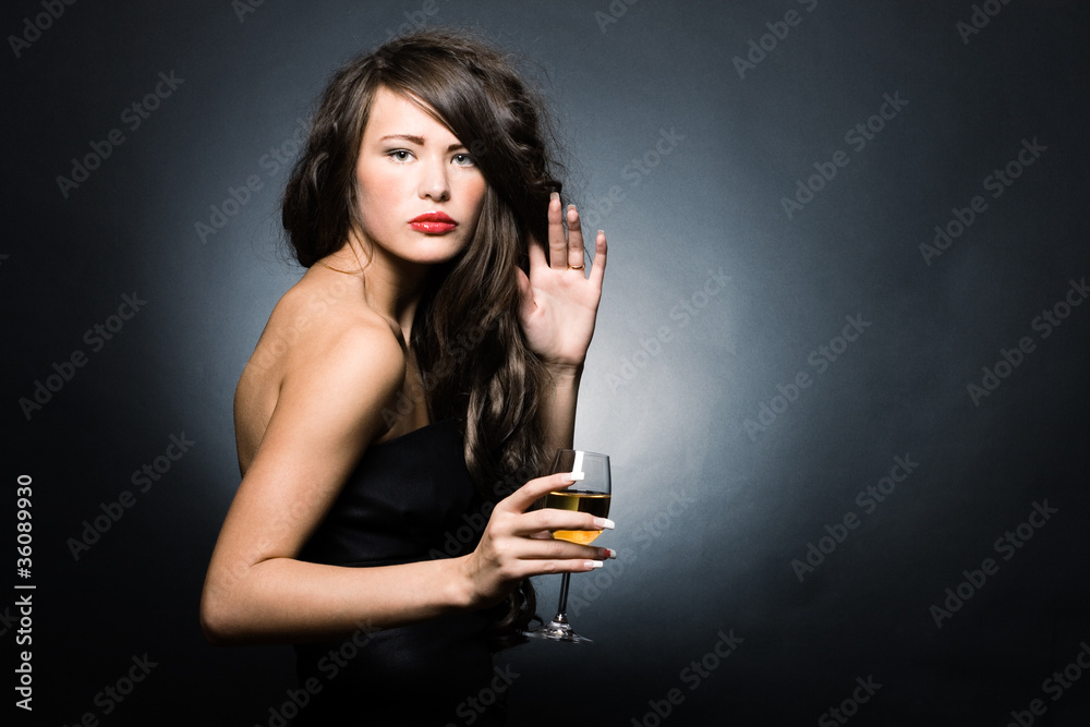 Beautiful sexy woman with a glass of white wine Beautiful sexy woman with a glass of white wine