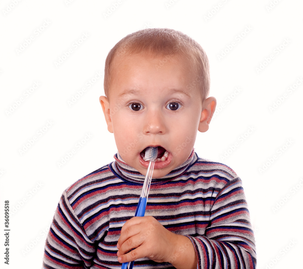 Boy brushing his teeth after bath Boy brushing his teeth after bath