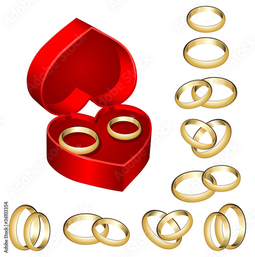 Set of gold wedding rings with heart-shaped box