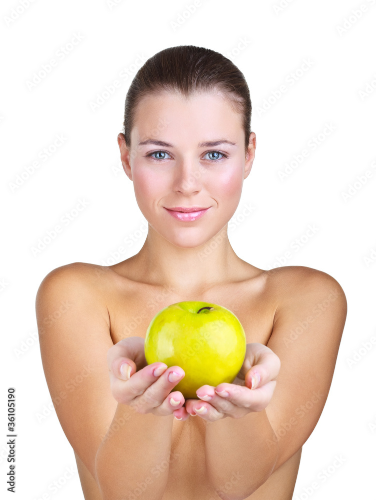 Woman holding apple in front of Woman holding apple in front of