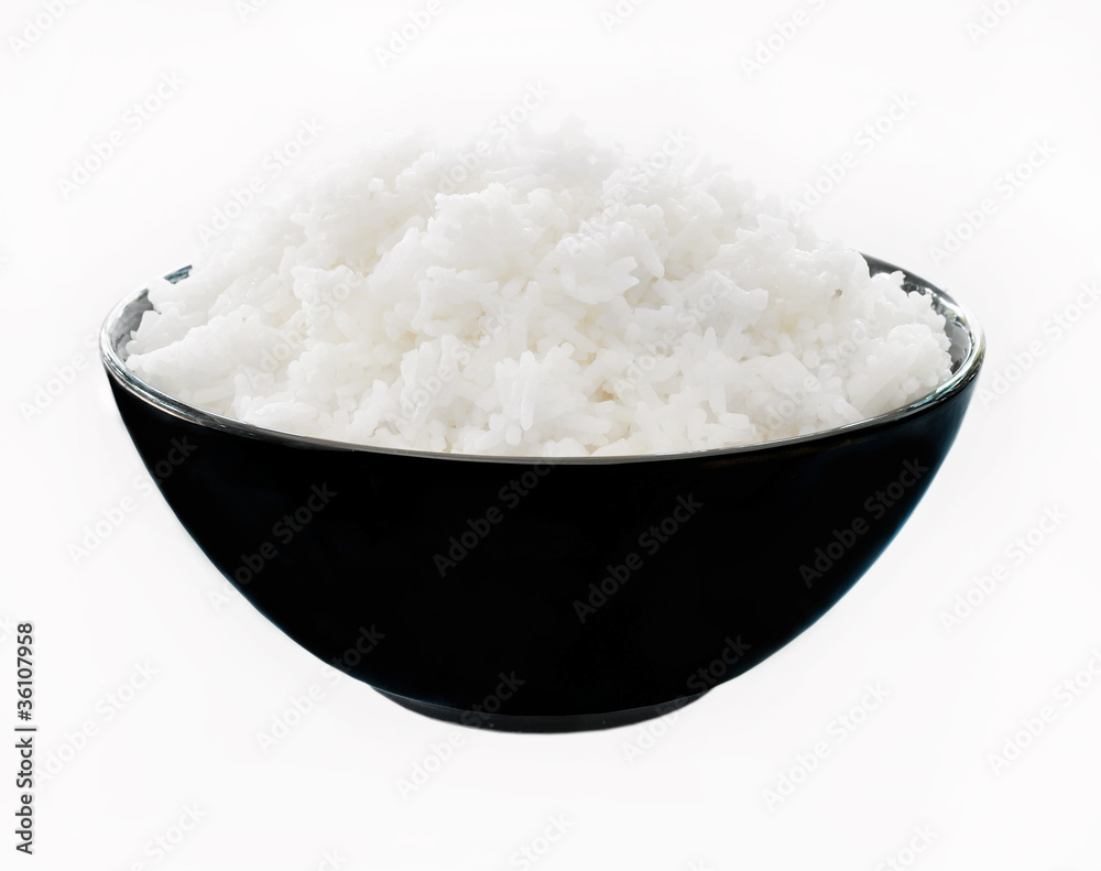 Rice in a bowl on a white background Rice in a bowl on a white background