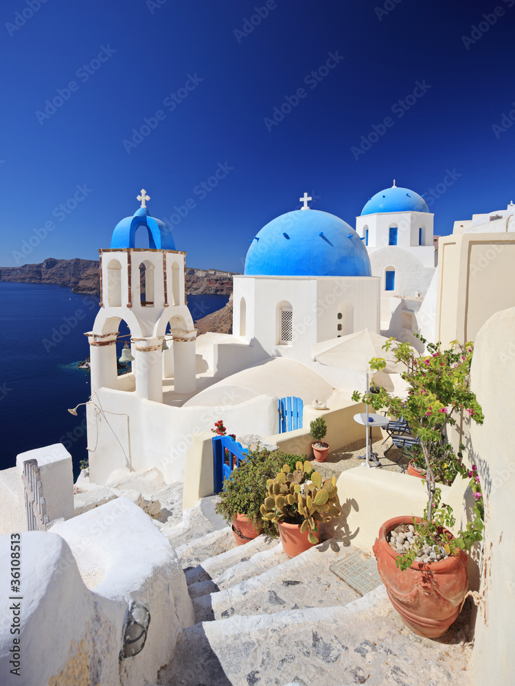 Blue dome church in Oia village on Santorini island, Greece