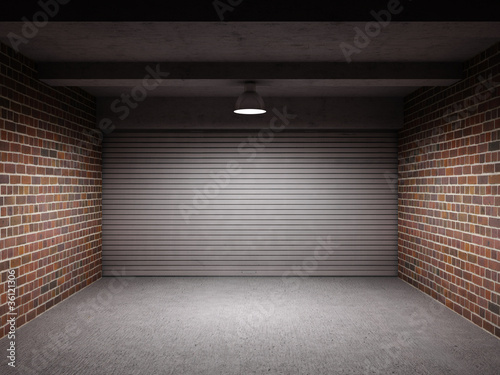 Empty garage with metal roll up door