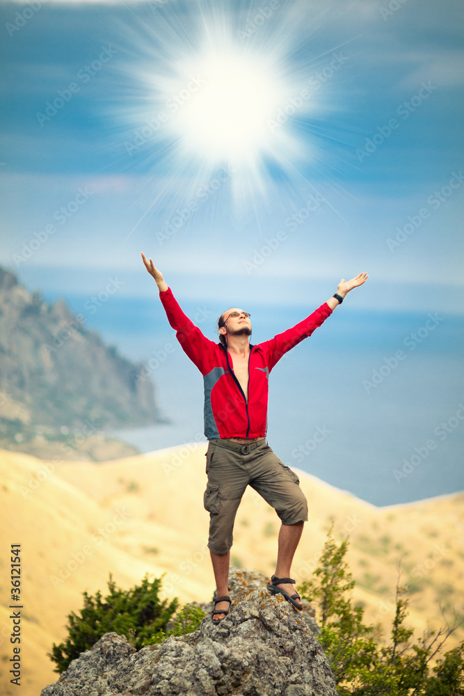 Man on top of mountain
