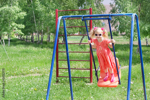 happy little girl on swing