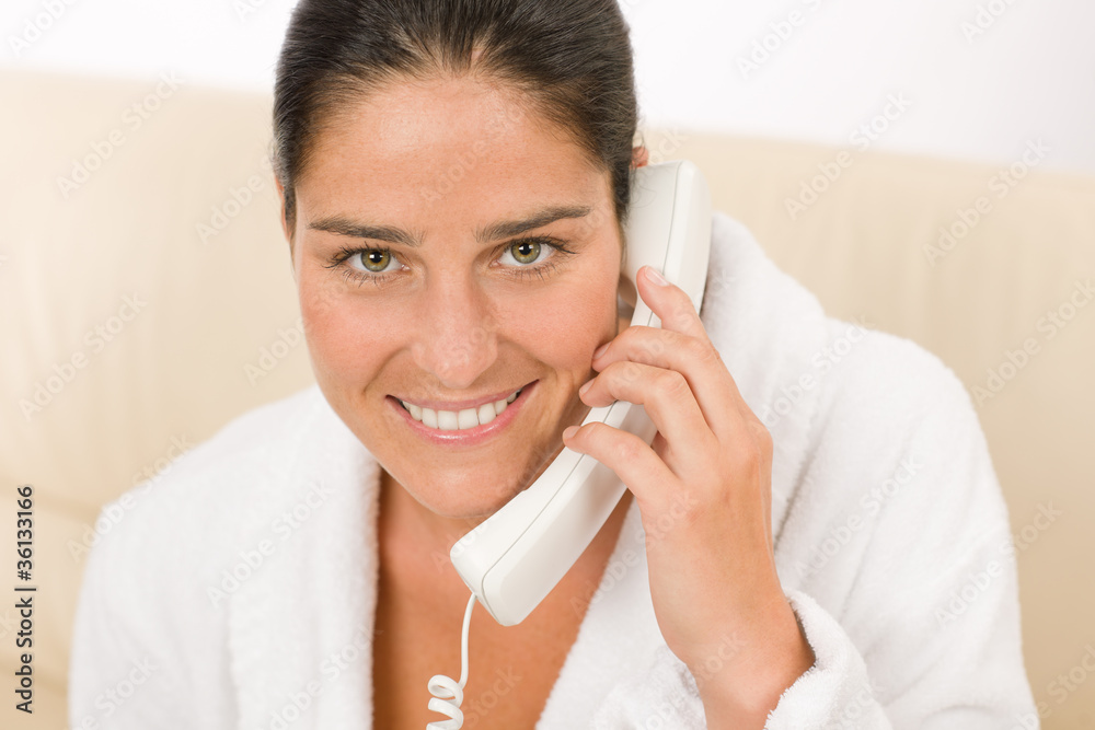 Attractive mid-aged woman on phone wear bathrobe Attractive mid-aged woman on phone wear bathrobe