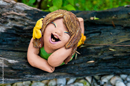 Fototapeta Naklejka Na Ścianę i Meble -  be funny doll stone in garden