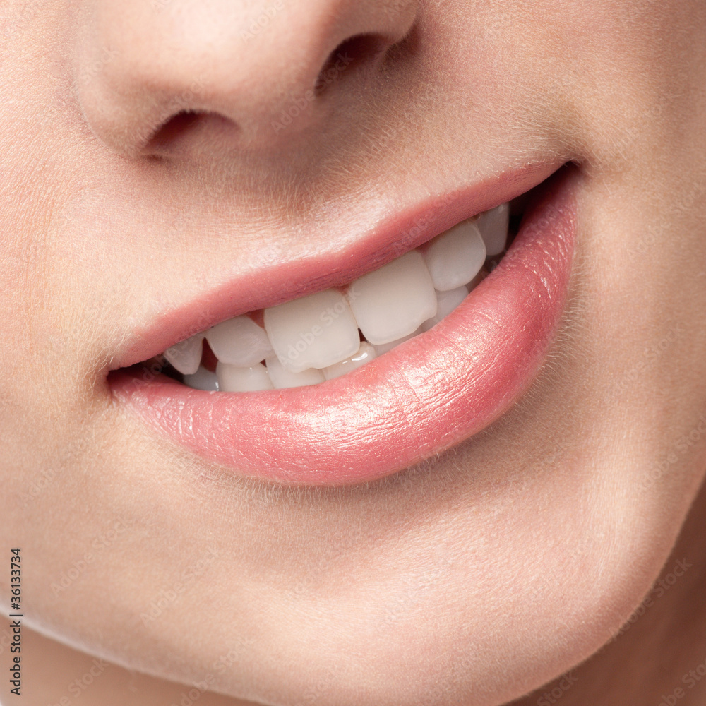 Fototapeta premium Close-up lips of beauty young woman