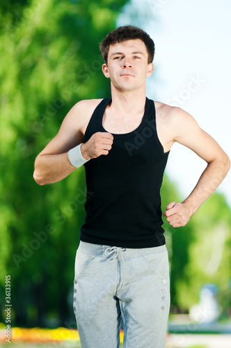 Young man jogging in park