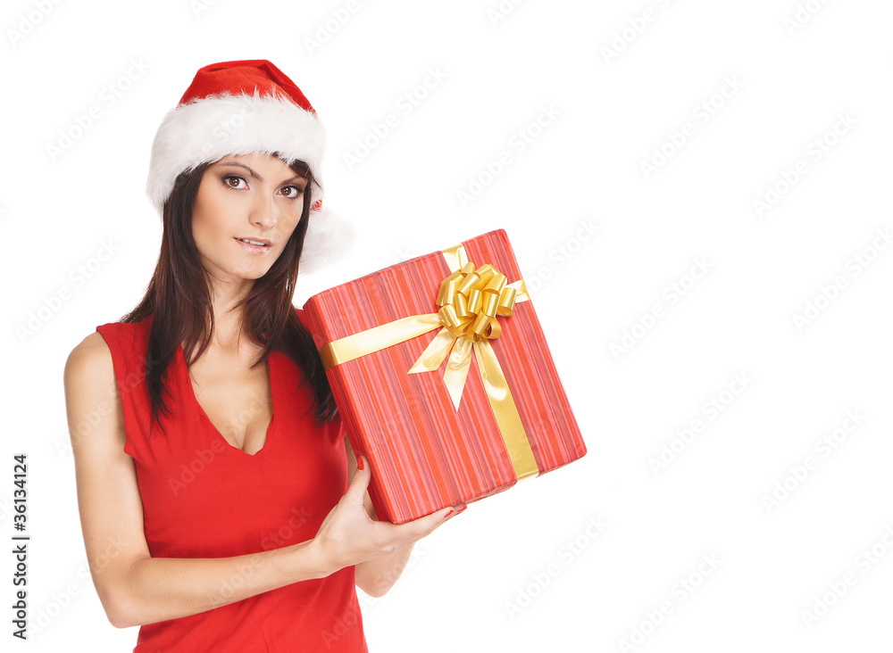 Portrait of a woman in a Christmas hat holding a present Portrait of a woman in a Christmas hat holding a present