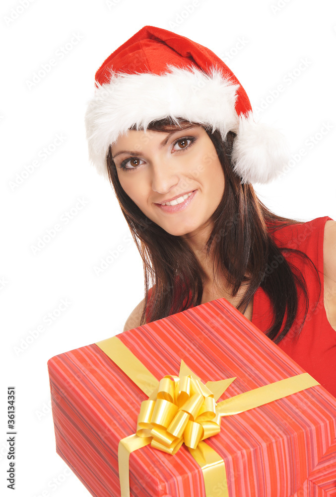 Portrait of a woman in a Christmas hat holding a present Portrait of a woman in a Christmas hat holding a present