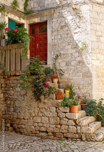 Ancient staircase with flowerpots.
