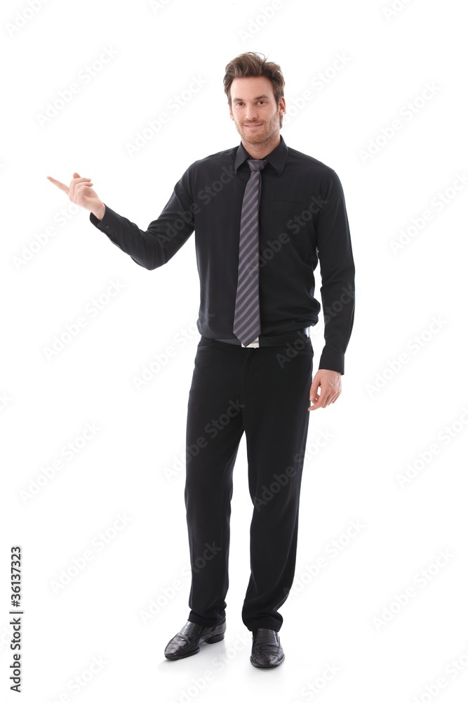 Businessman balancing sg on forefinger Businessman balancing sg on forefinger