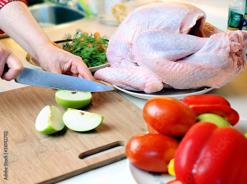 chopping food ingredients on wooden board for turkey' stuffing
