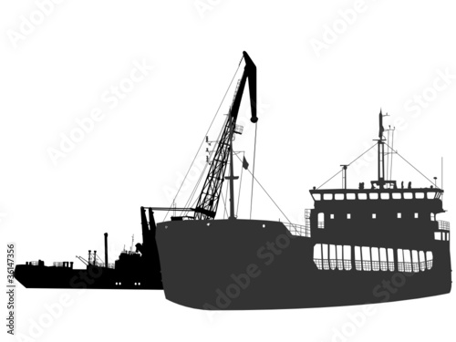 Silhouettes of the barge and the floating crane