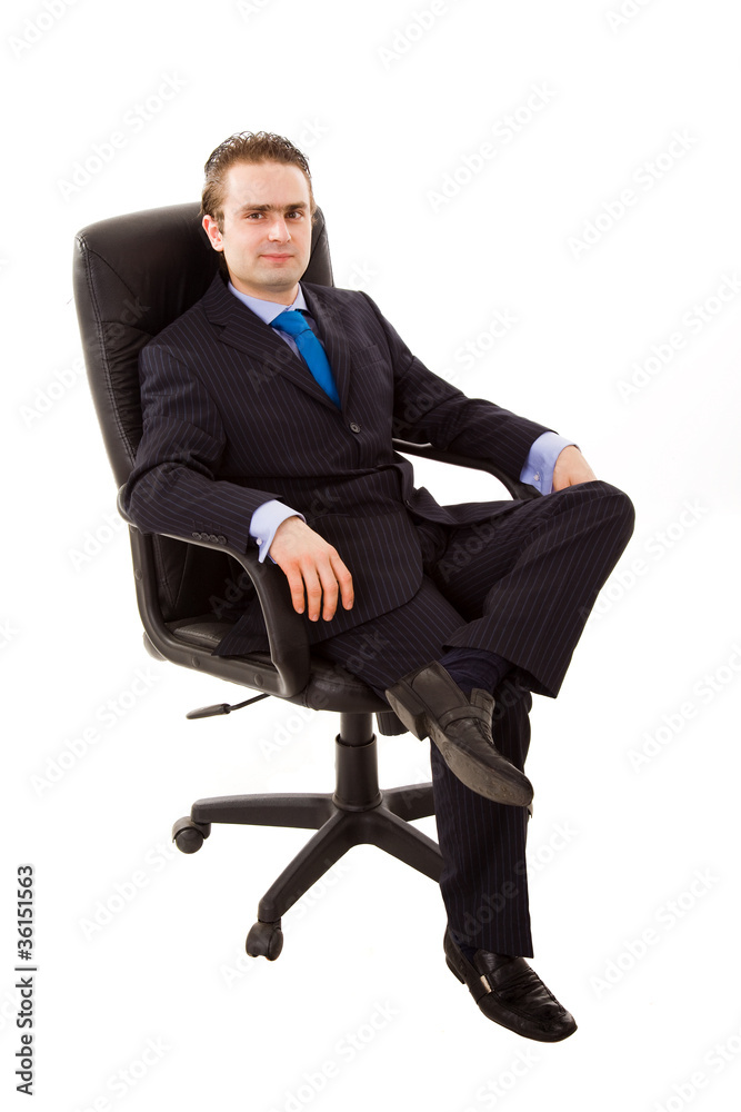 successful young business man sits on office chair over white ba successful young business man sits on office chair over white ba