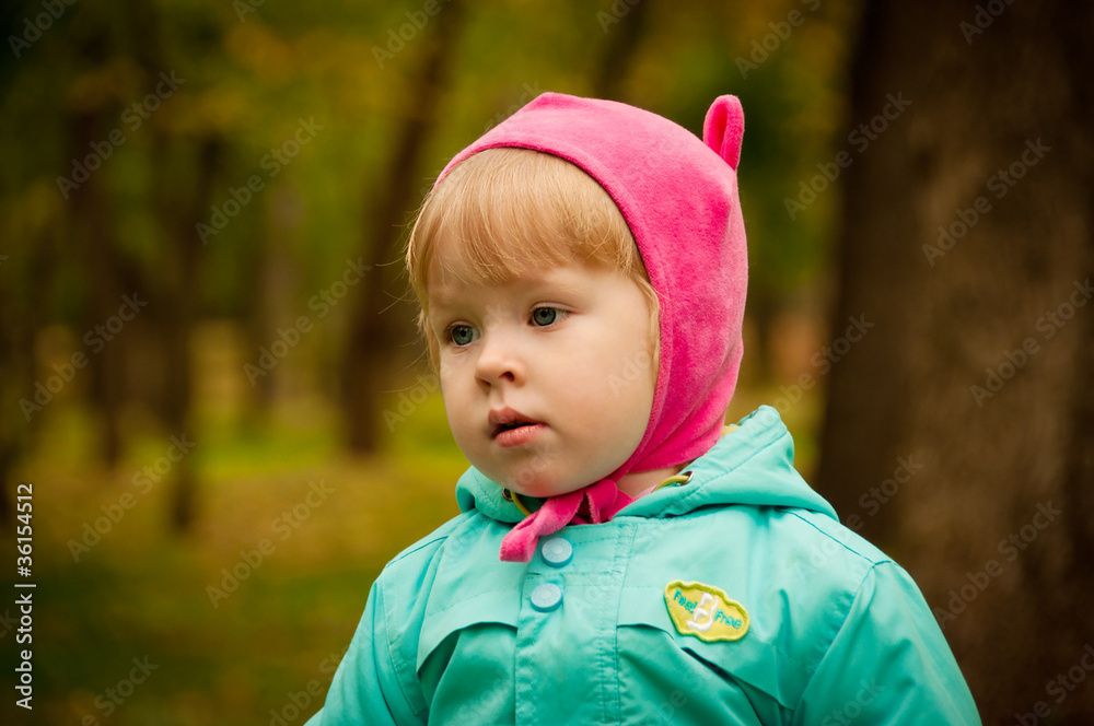 Cute child walking in autumn park Cute child walking in autumn park