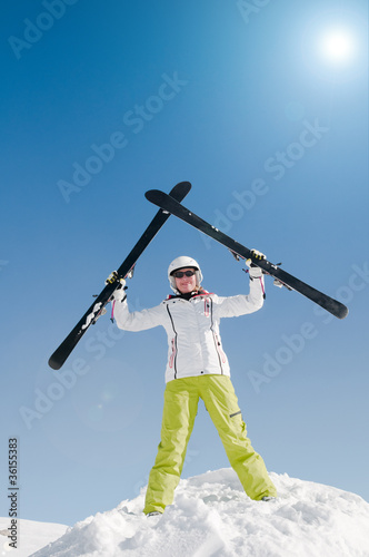 Skiing - portrait of female skier (copy space, cover) photo