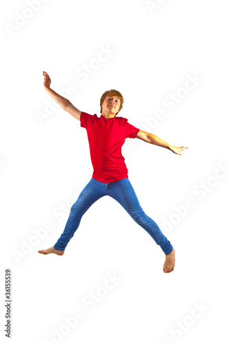 smart boy with red shirt jumping in the air