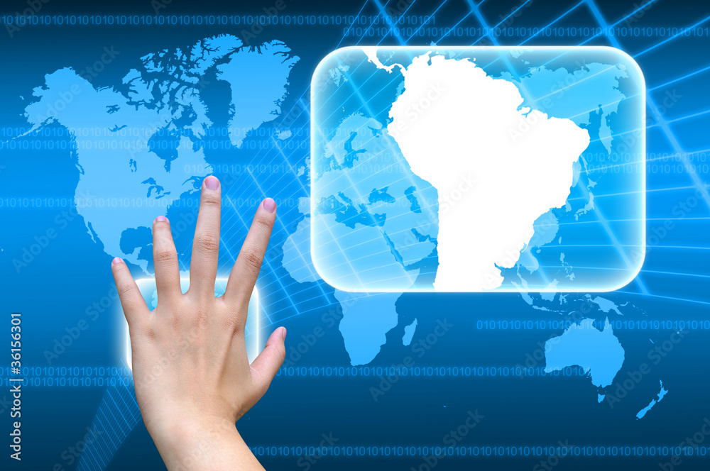 hand pushing South America Continent on a touch screen hand pushing South America Continent on a touch screen