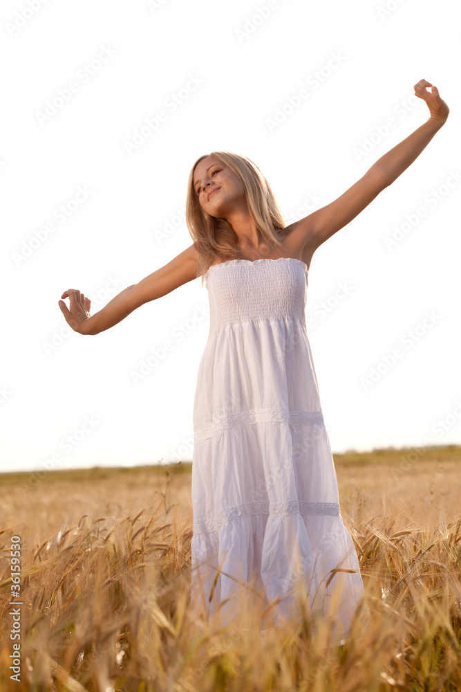 woman walking on wheat field