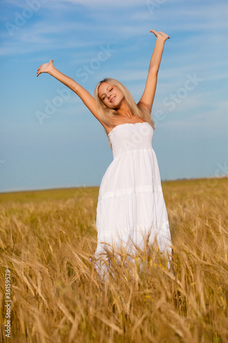 woman walking on wheat field