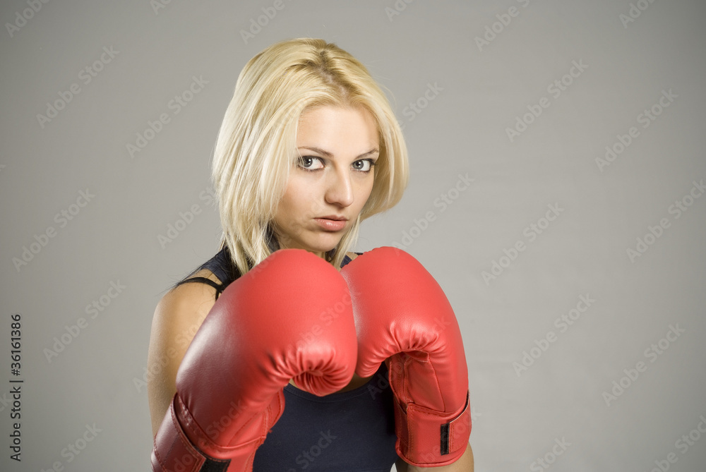 Boxing pose woman boxer with red gloves Boxing pose woman boxer with red gloves