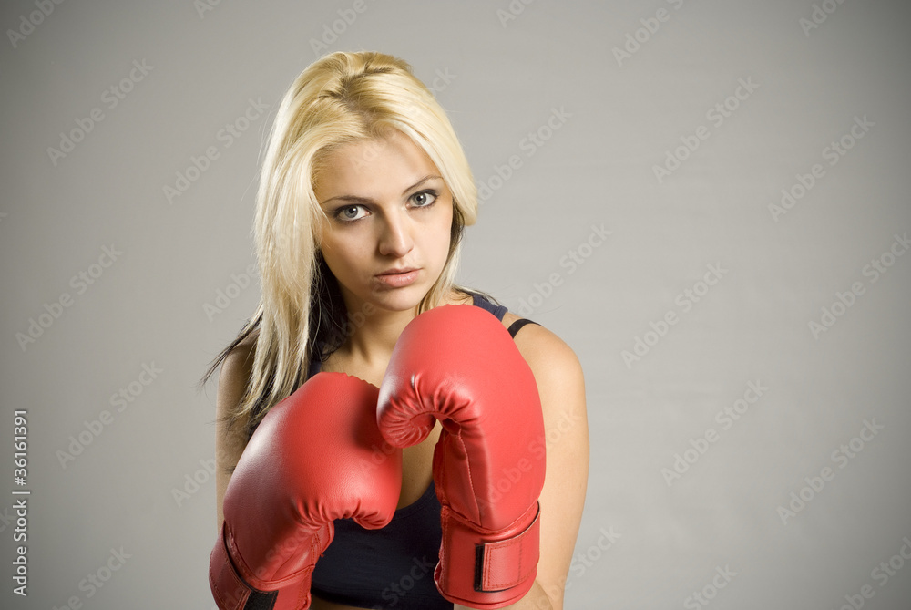 Fighting woman boxer with red gloves Fighting woman boxer with red gloves
