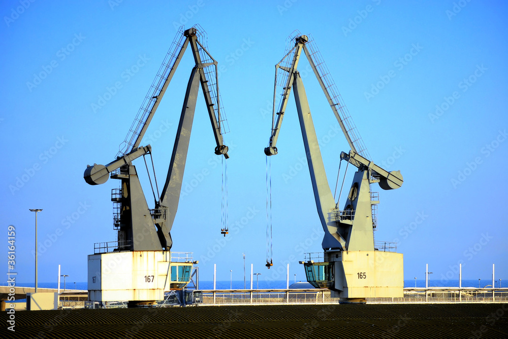 cargo cranes in port of barcelona
