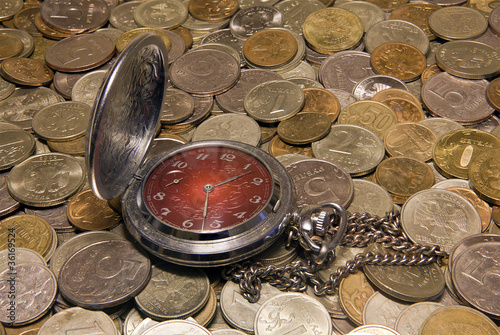 Pocket watch against Russian coins.