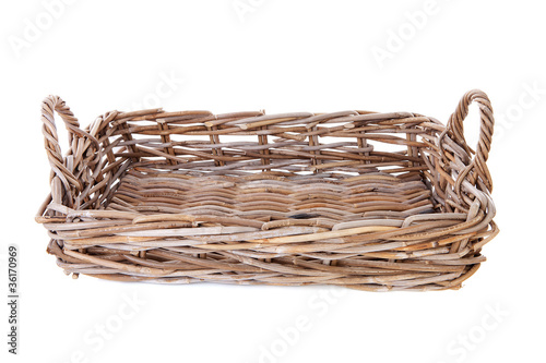 Big empty cane basket over white background