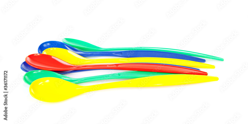 colorful plastic spoons over white background colorful plastic spoons over white background