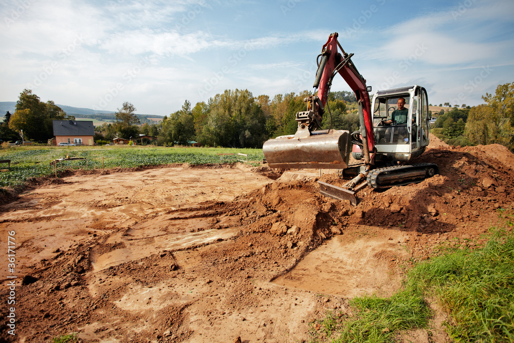 Obraz premium start of building a house, earth moving