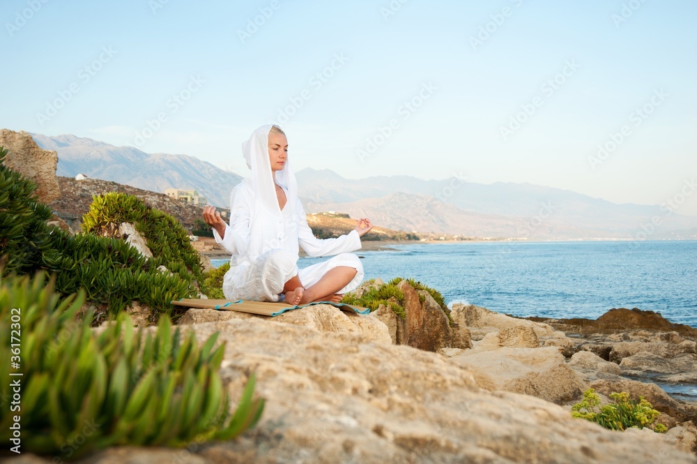 Young woman meditating outdoors