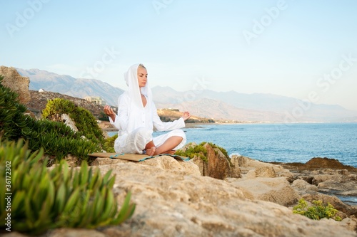 Young woman meditating outdoors
