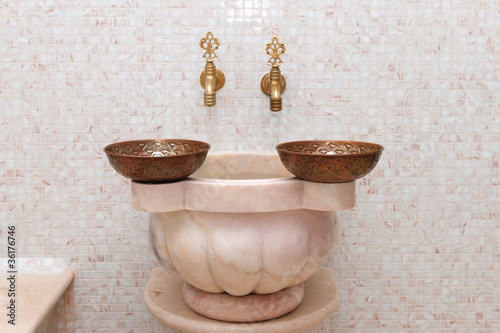 faucets and  copper bowl in turkish hamam