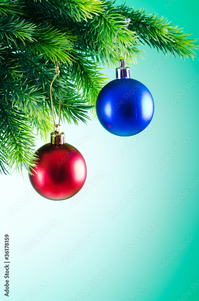 Baubles on christmas tree in celebration concept Baubles on christmas tree in celebration concept