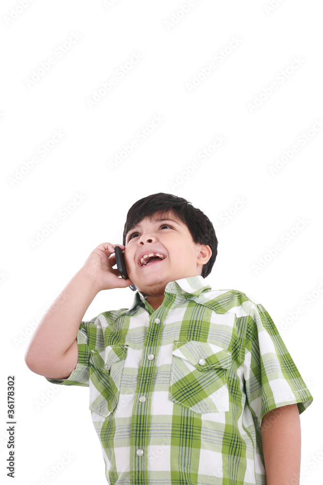 Beautiful little boy laughs and talks by mobile phone. Beautiful little boy laughs and talks by mobile phone.