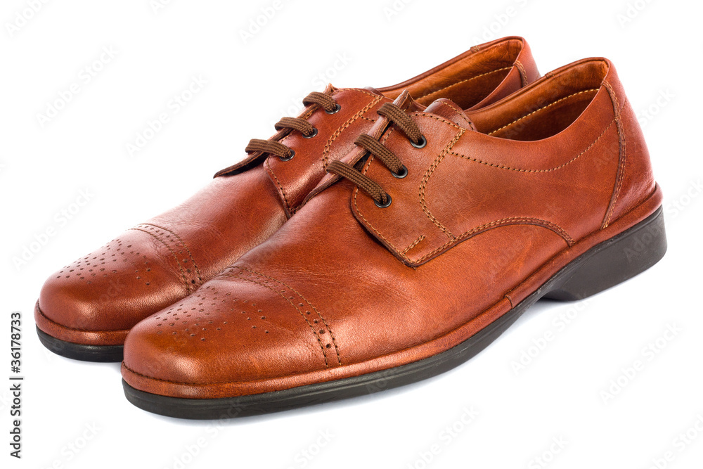 The brown elegant men's shoes on the white isolated background