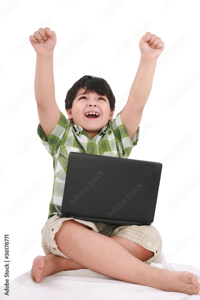 Happy little boy with laptop with moving apart his hands - indoo Happy little boy with laptop with moving apart his hands - indoo