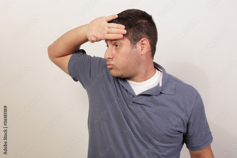 Man wiping off his sweat Man wiping off his sweat