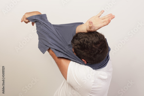 Man stuck inside of his shirt
