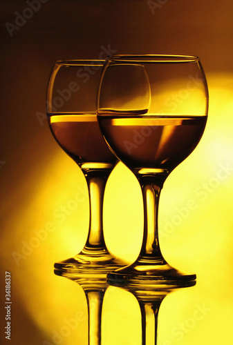 Two wineglasses on the mirror