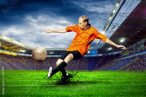 Football player on field of stadium © Andrii IURLOV