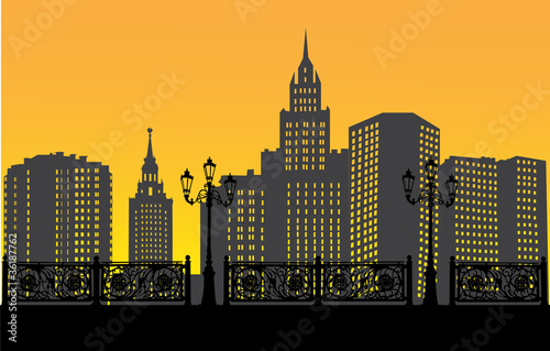 sunset city landscape with fence