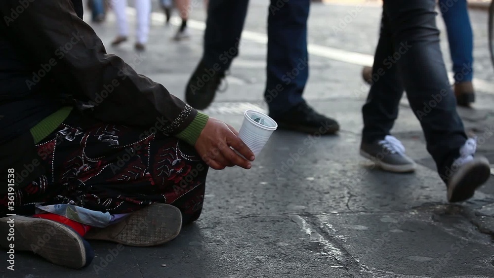 Woman homeless in city begging